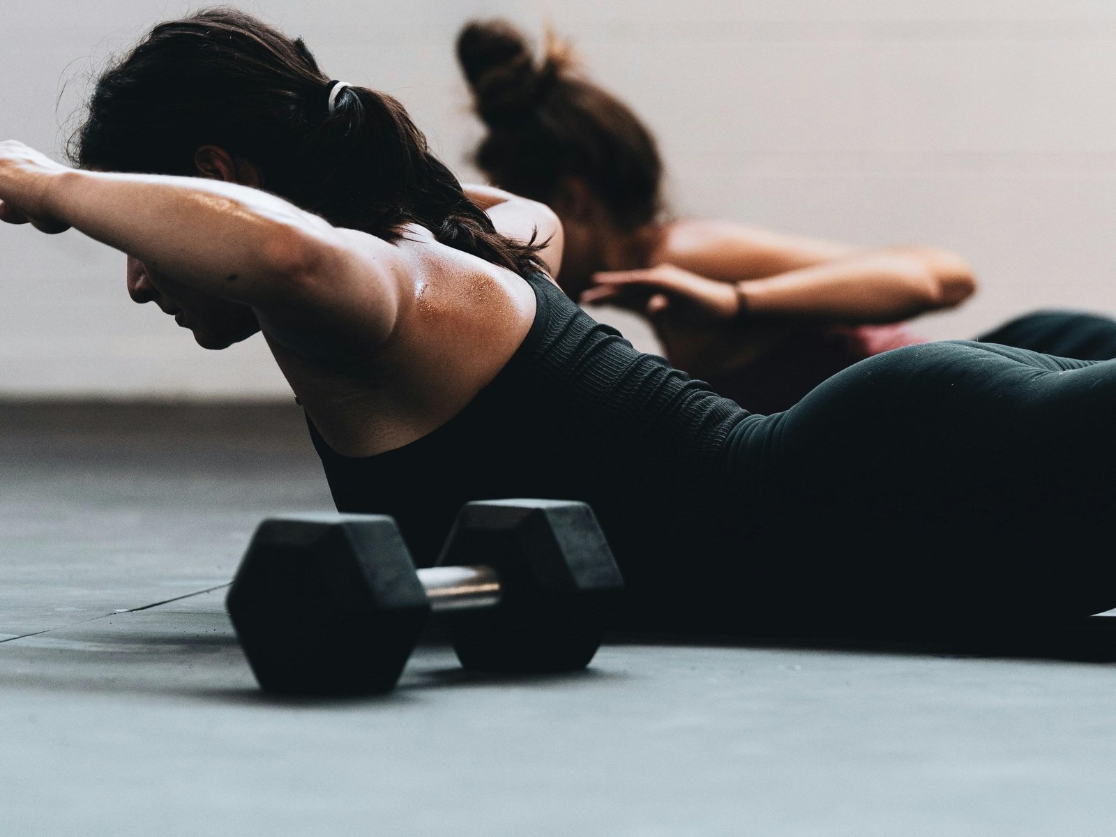 Woman strength training with weights